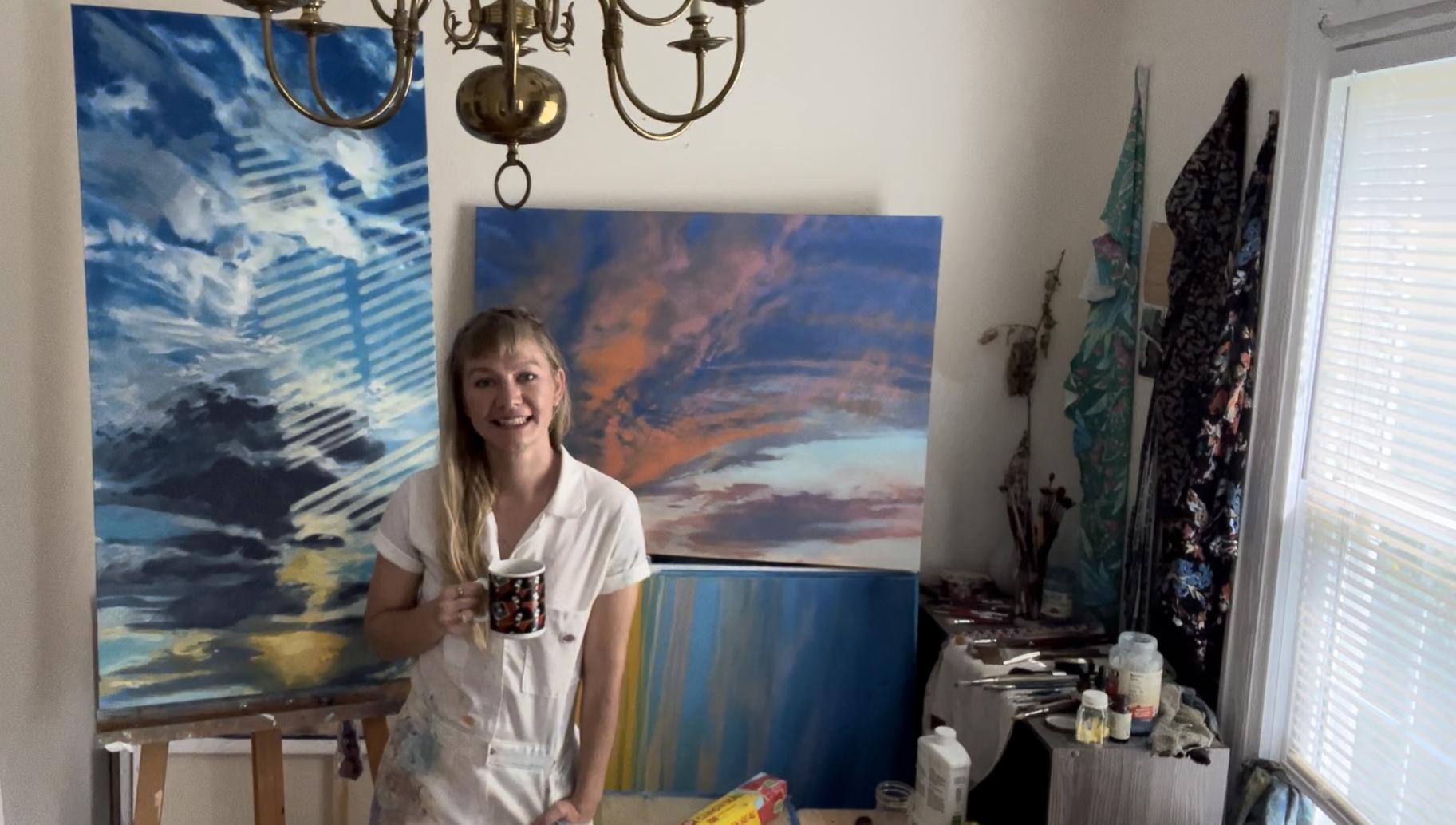Annie Klaas in front of paintings