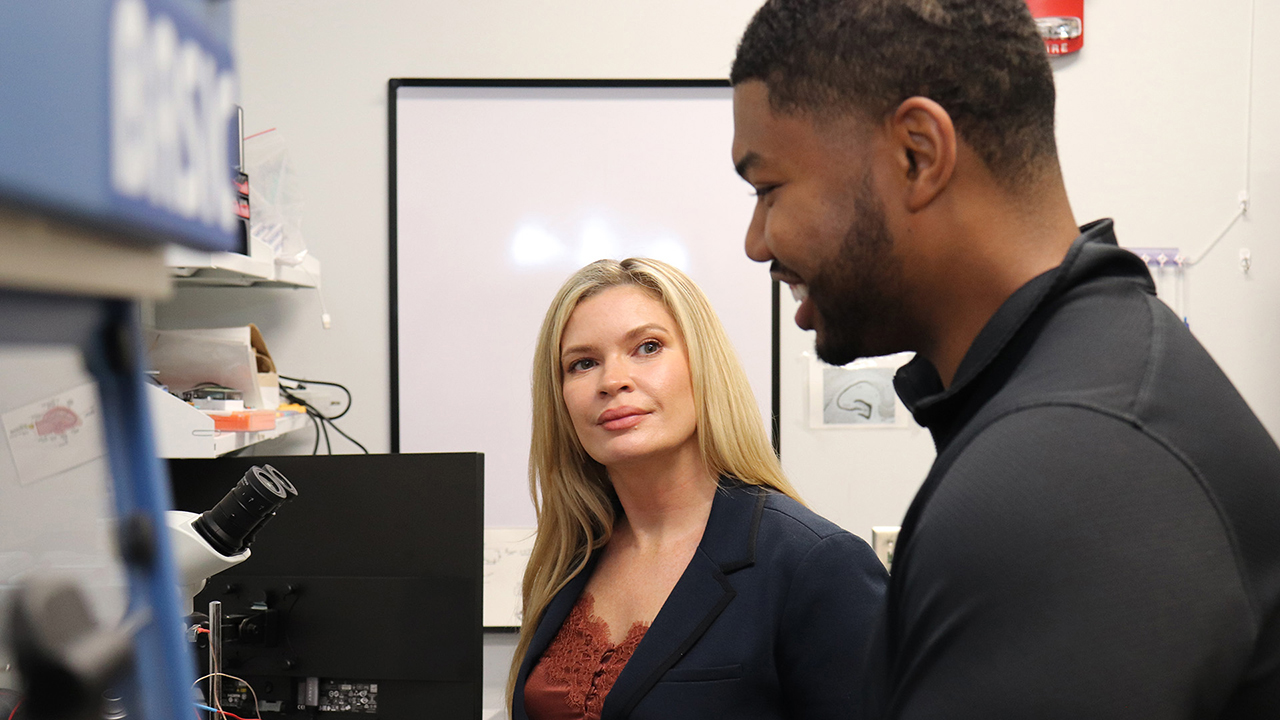 Miranda Reed and student in lab