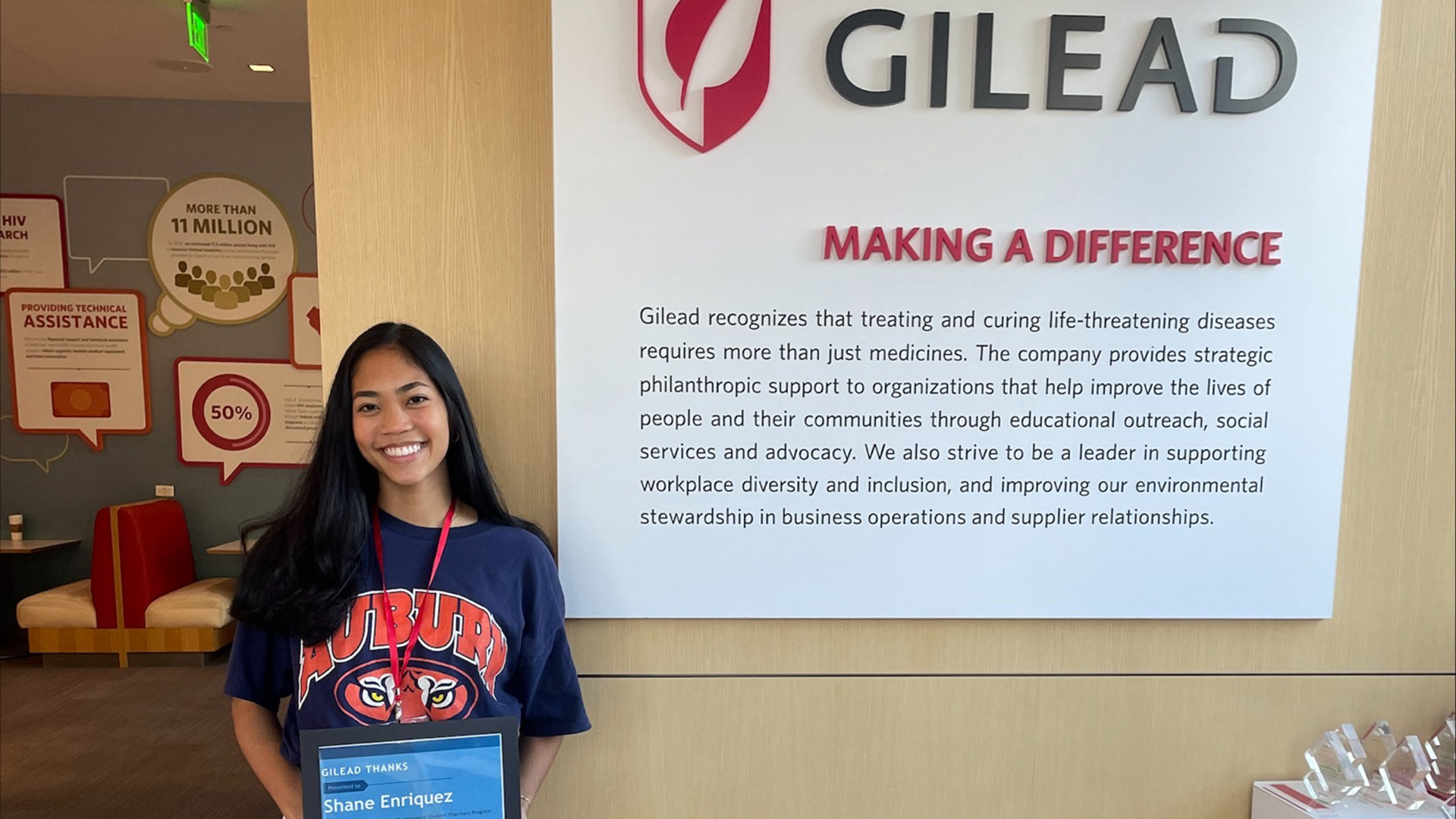 Shane Enriquez stands next to Gilead sign