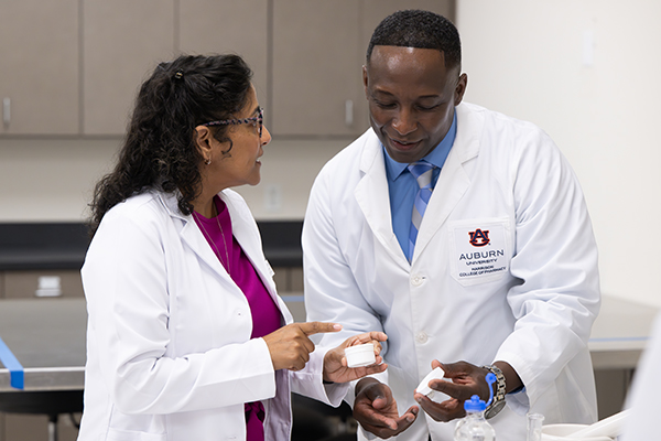 Faculty member and student work in lab