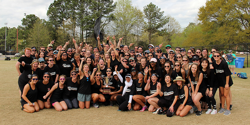 Students holding a trophy